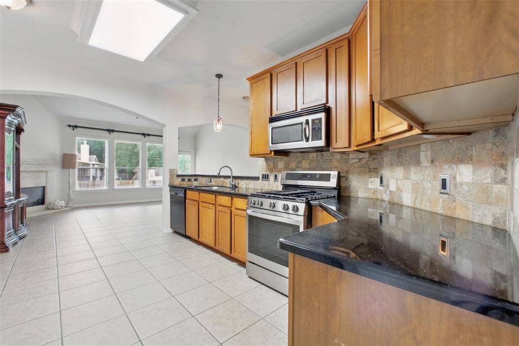 The counter space in the kitchen of this house is just perfect for those who love to cook and those who like to entertain.