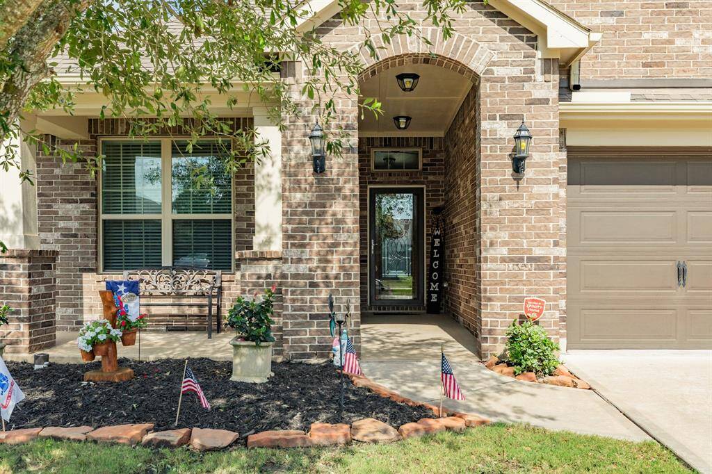 Welcome home, 9534 Ocean all brick with a beautiful wooden and glass front door and do not forget the front porch
