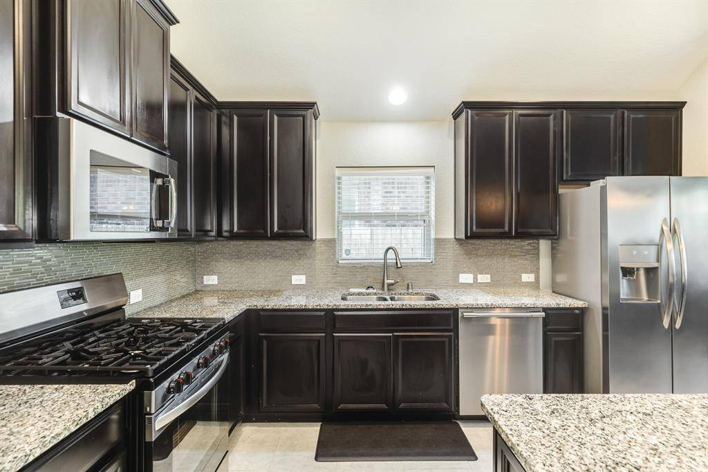 another view of this great space in the kitchen and the refrigerator also stays with the home