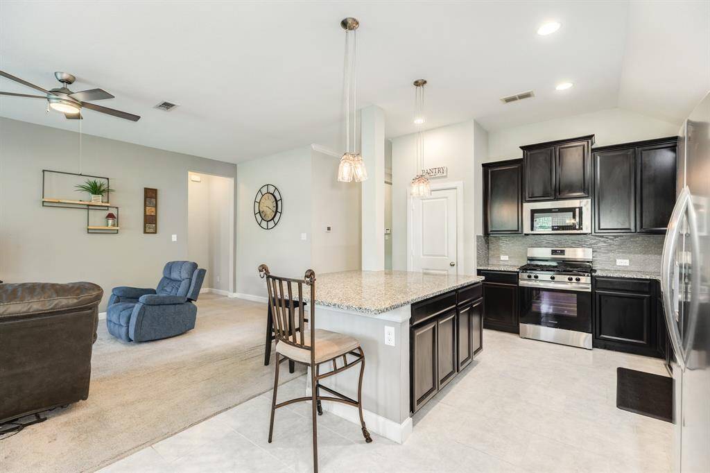 this view shows the seamless flow from kitchen to family room which is great for entertaining