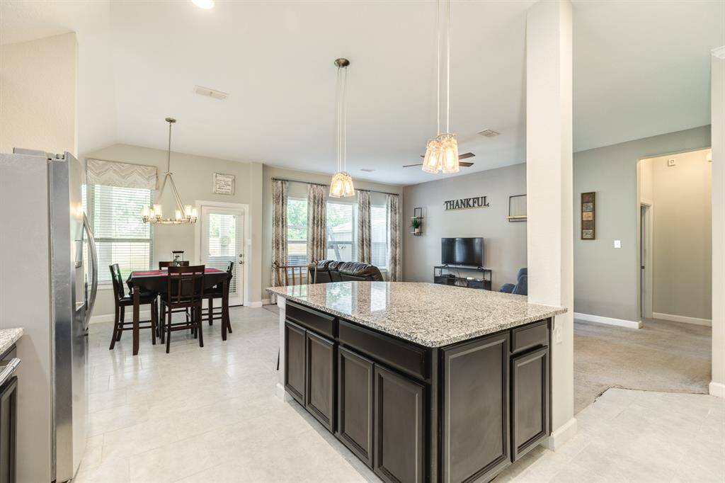 this is a great view of the dining area, family an oversized island