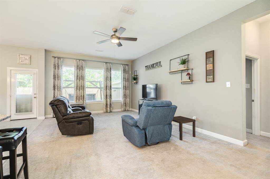 family area is very spacious lots of windows over looking the backyard on the right you have the entrance to the primary which is located behind the family room