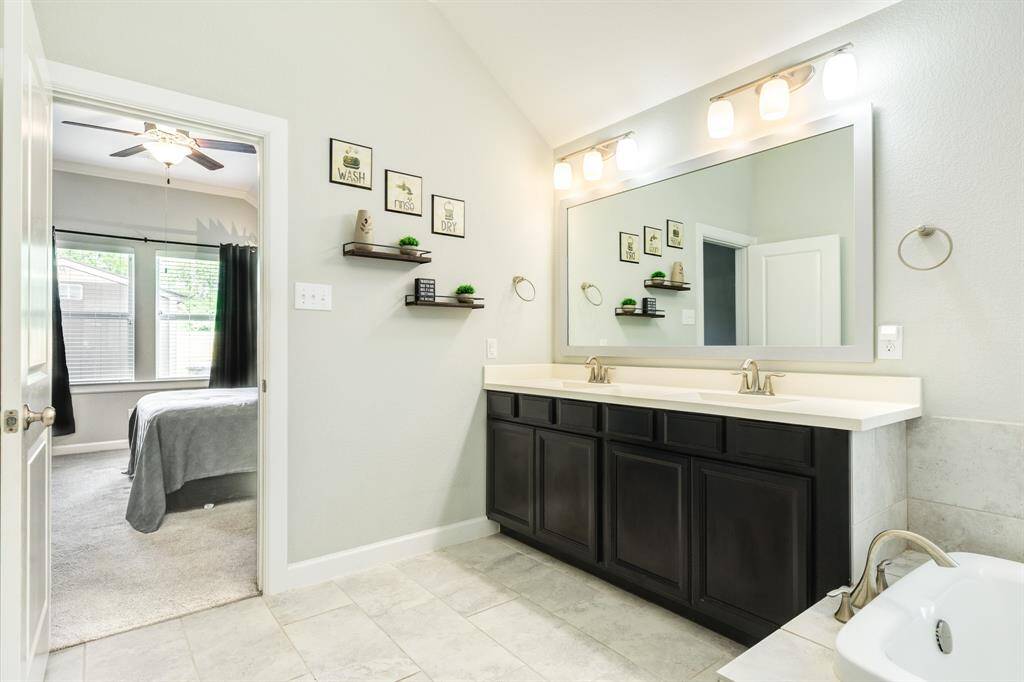 from this view you can see the large mirror and great lighting over the sink area