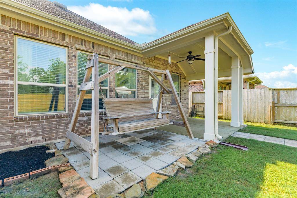 the swing has a great area with pavers and great rock edging