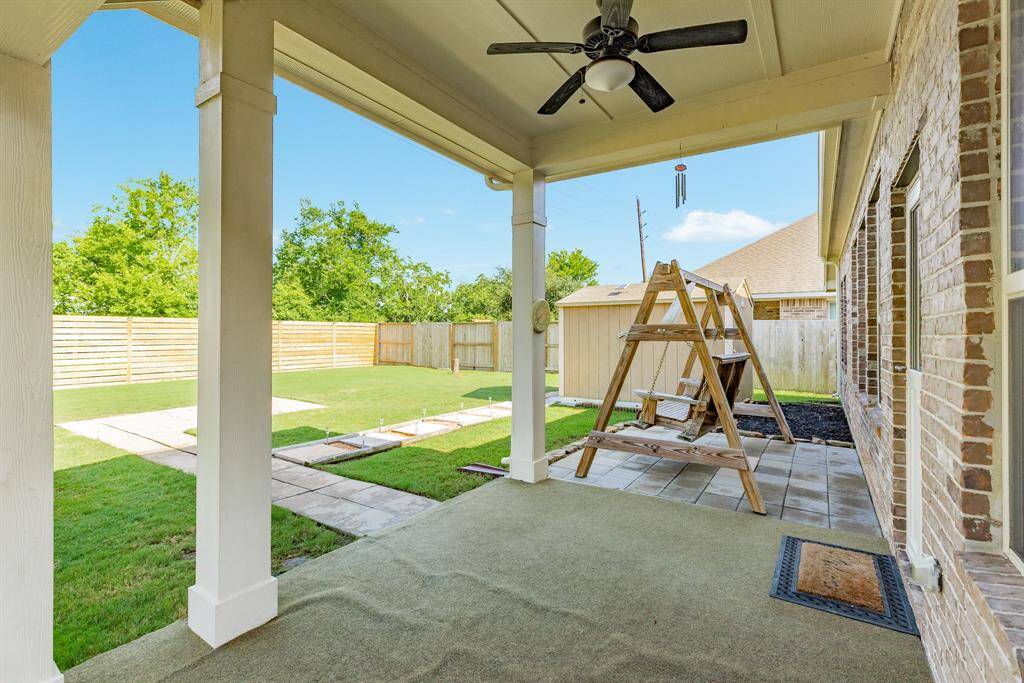the covered patio with ceiling fan the rug is removable