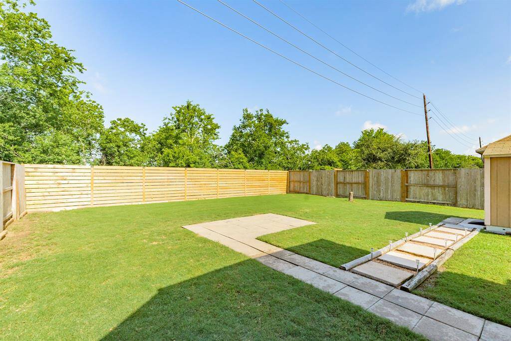 great back yard with new fence