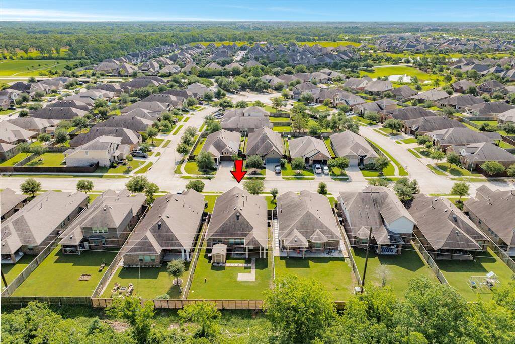 this aerial shows how large the backyard is and surrounding neighbors