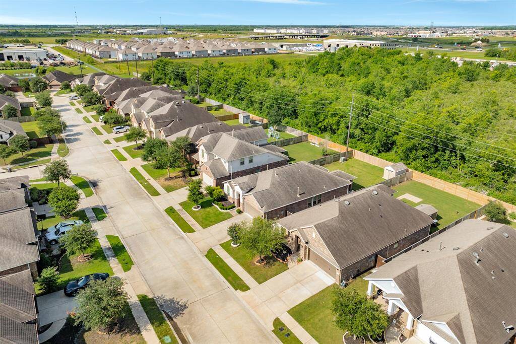from this aerial you can see in the background on the left shopping area that has a restaurant, dentist, barber shop and more