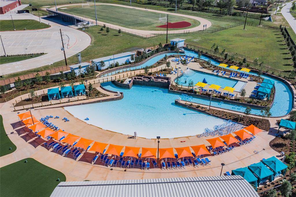 adventure cove, which has a lazy river, wave pool, family pool cabanas , in the back ground is Caffey middle school a practice field