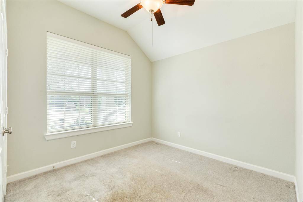 this bedroom faces the street has lots of natural light