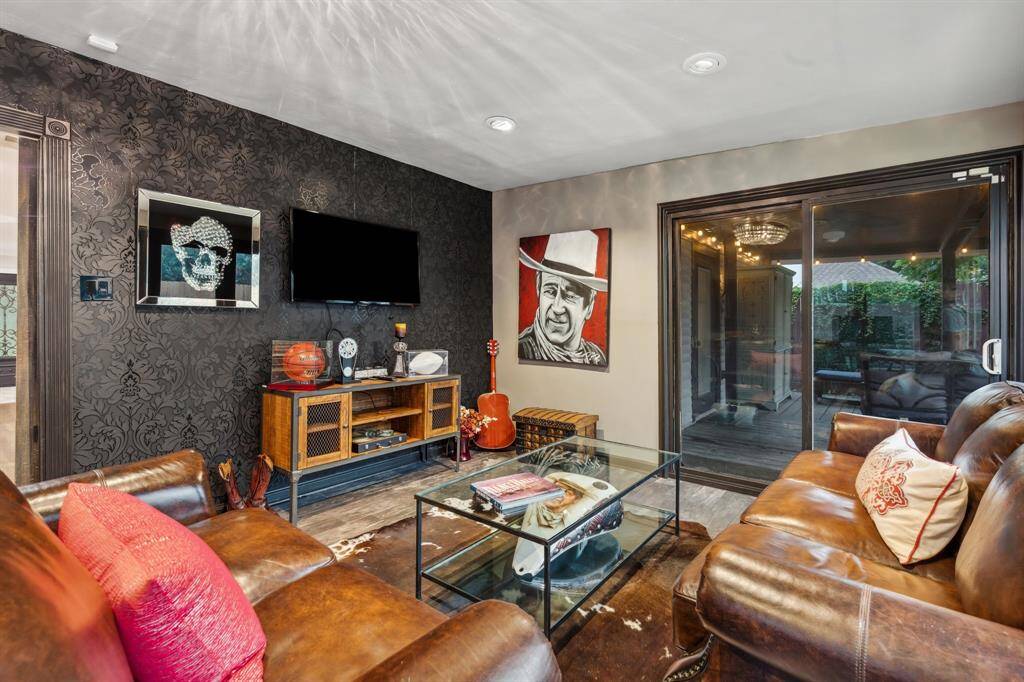 This bonus space is a standout—surrounded by updated windows and a double glass door, it’s ideal as a media lounge, hobby room, or stylish home office with direct access to the backyard.
