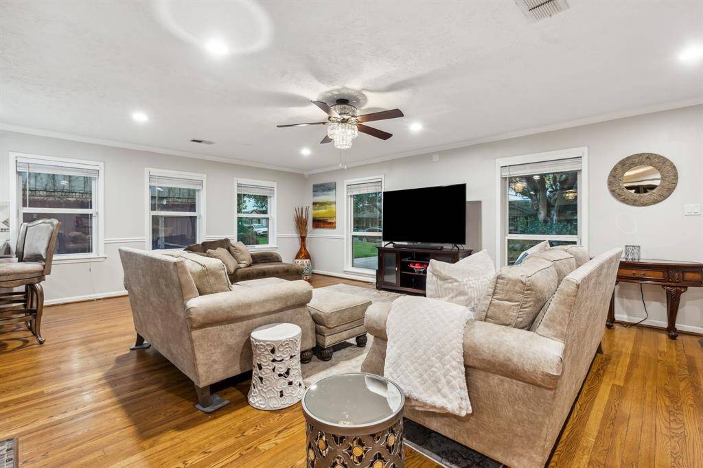 This angle showcases the home’s thoughtful layout with a direct line of sight from the front door to the main living spaces, creating a natural sense of flow. The combination of elegant finishes and open concept design is ideal for modern living.