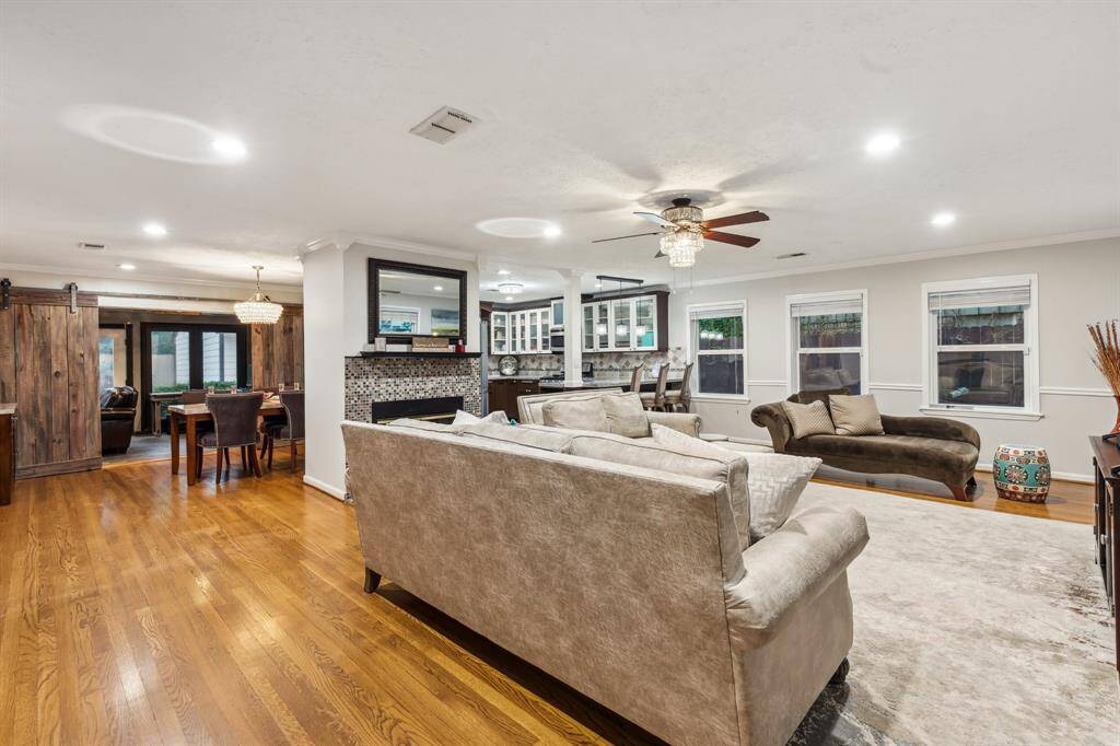 From hardwood flooring to crown molding and recessed lighting, every detail in this living room blends comfort with timeless appeal. There's room for oversized furniture, entertaining, and everyday lounging.