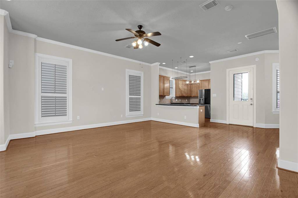 Spacious living room with wood floors