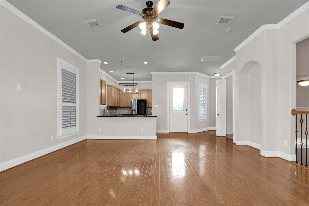 Open concept between living room, kitchen, and dining room