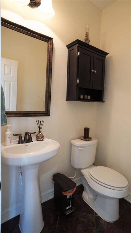 Half bath located downstairs for guests.