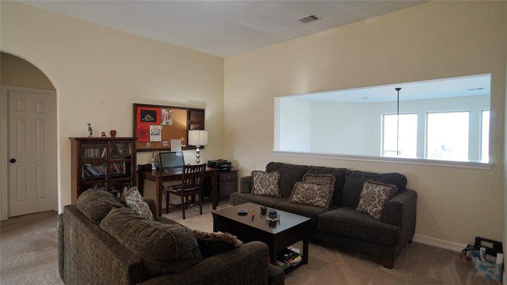 Upstairs game room overlooking living room below.