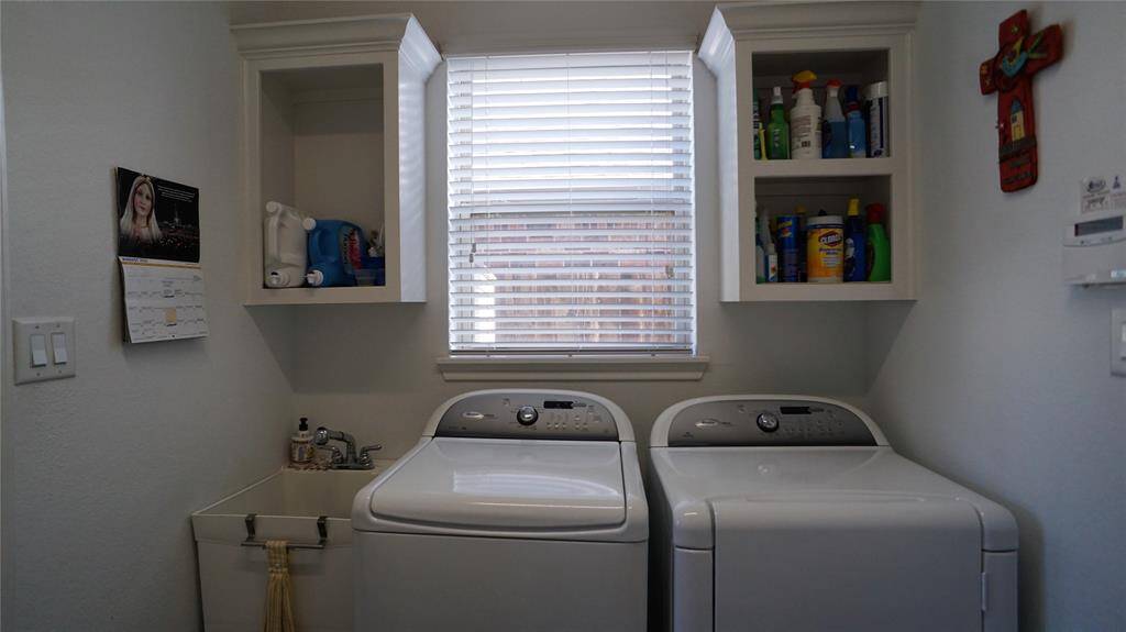 Large utility room with built in shelves.   Washer and Dryer do not stay.