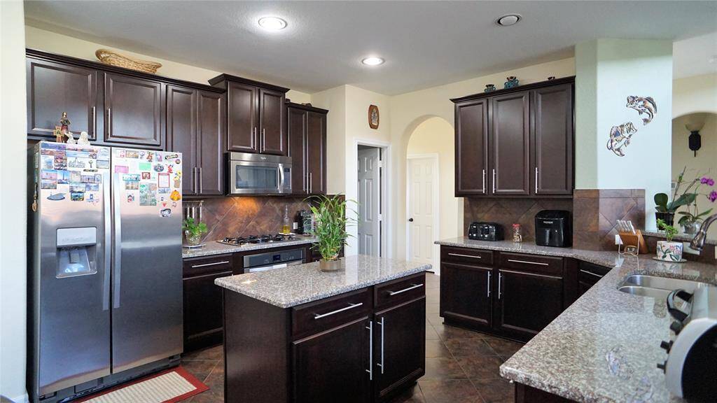 Large Kitchen with plenty of cabinets, island, granite counter tops and undermount sink.  Refrigerator comes with lease.