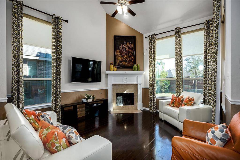 Family room with Lots of natural light, wood floors and fireplace