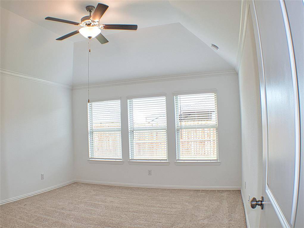 Primary bedroom in the home with new carpeting