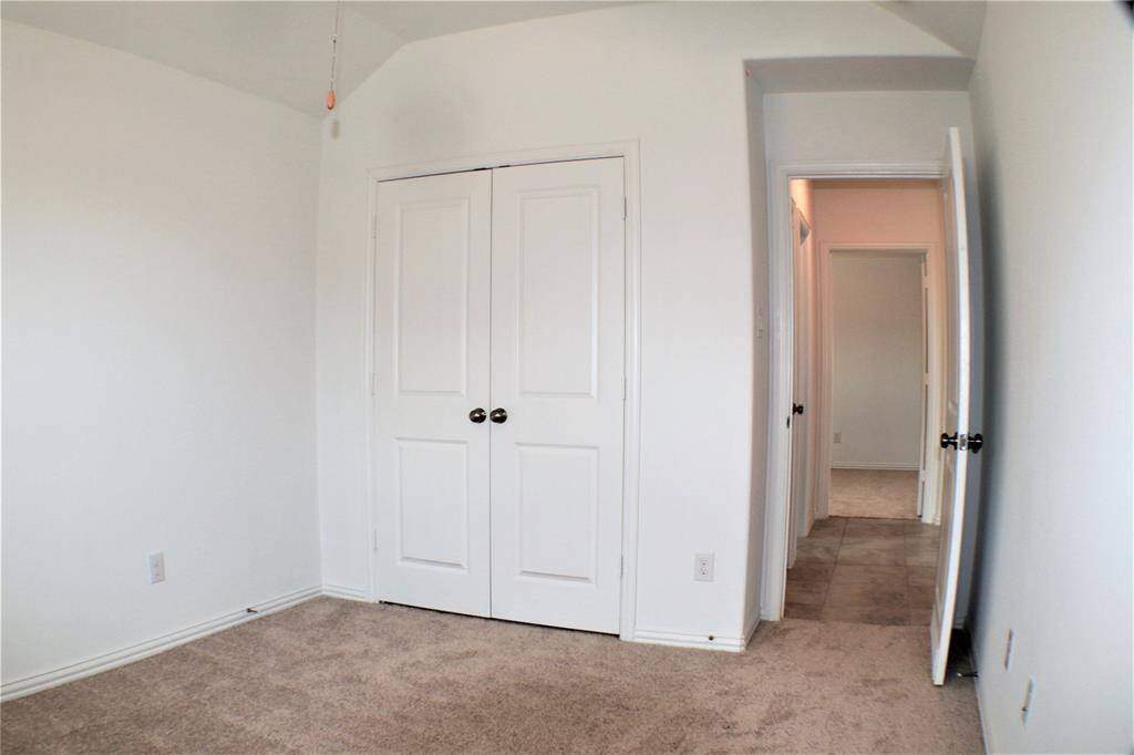Closet and entry to the hallway from the bedroom