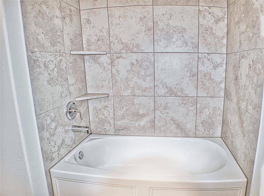 Soaking tub and shower in the second full bathroom