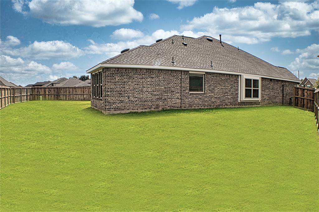 Large freshly sodded backyard