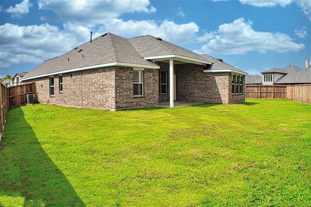 Reverse side of the backyard with view of the back patio
