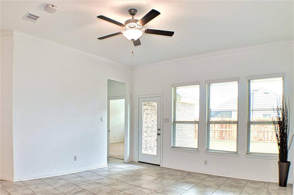 Breakfast area with door leading to the backyard and patio