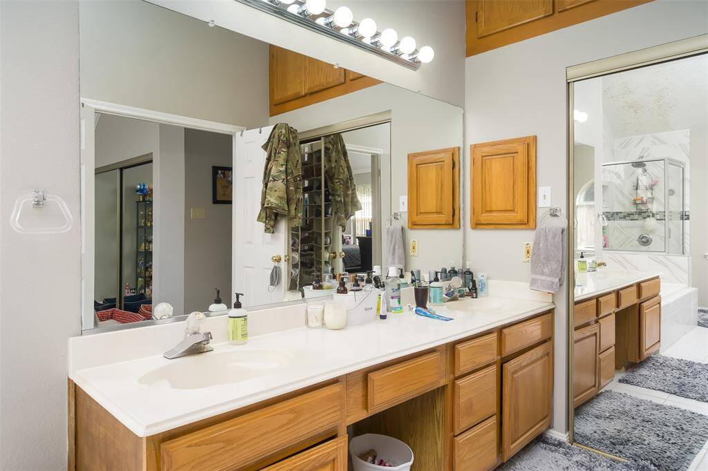 Primary Bath double sinks & extra storage above closet