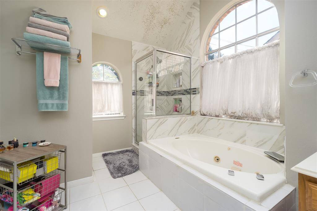 Shower and jetted tub in the primary bath