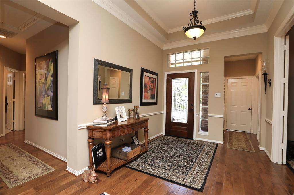 Hallway goes to secondary bedrooms and full bath