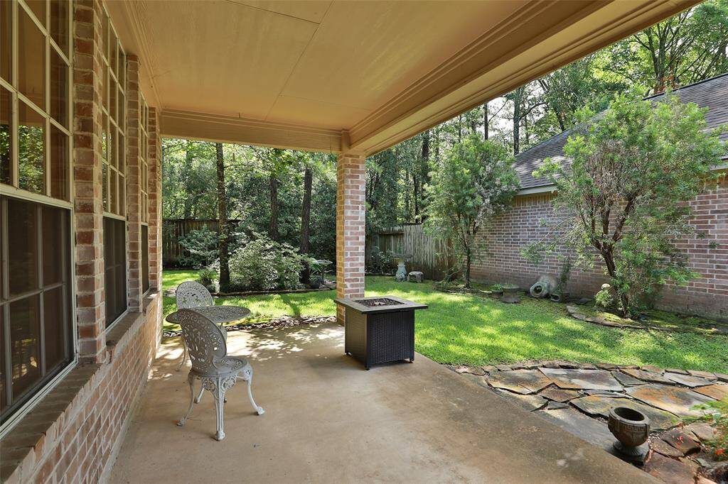 Covered porch off the kitchen and den