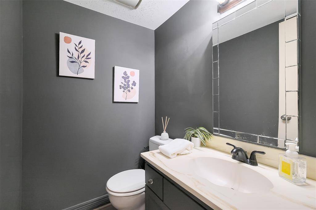 Newly painted half bath located downstairs.