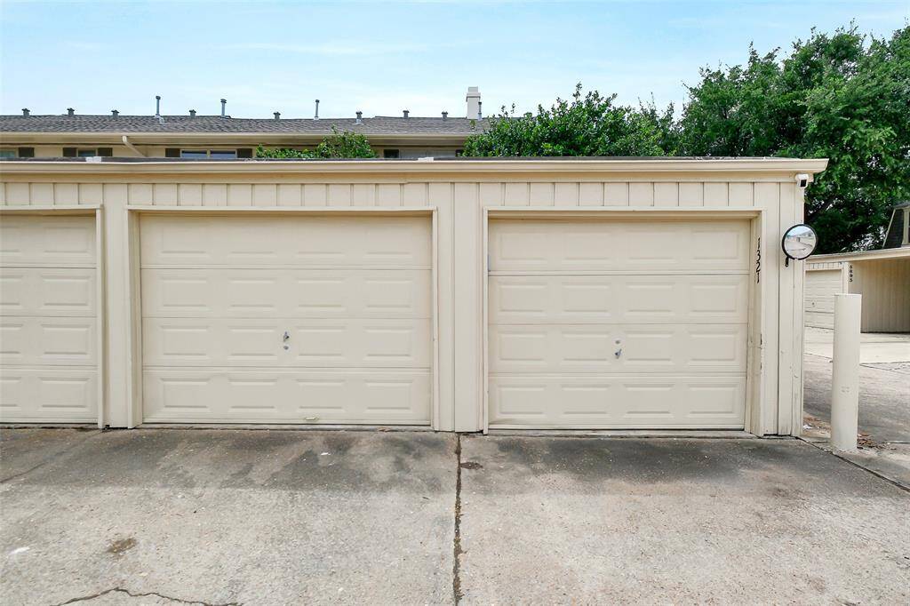 Outside find two garages.