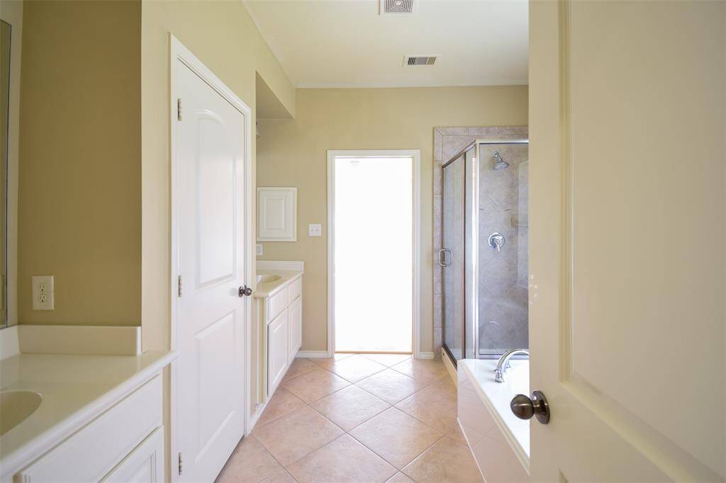 Great master bath with large walk in closet and built ins