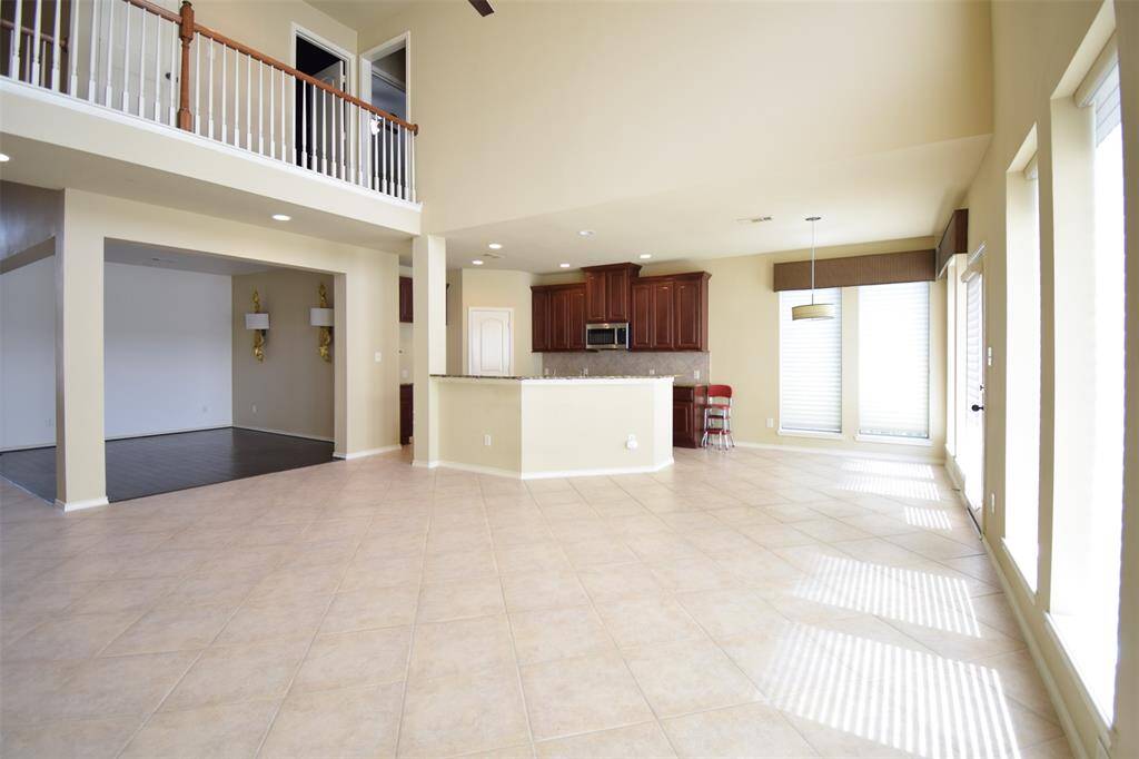 Soaring 18  ceilings and tile floors