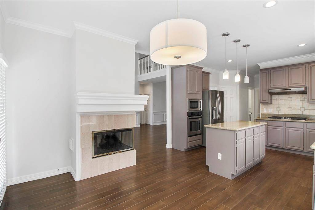 The double-sided fireplace is also in the kitchen/breakfast area.