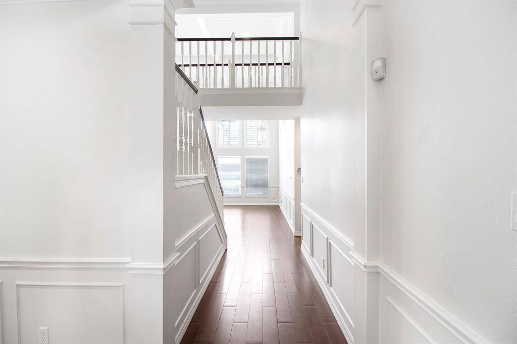 The hallway leads to the living area and kitchen.