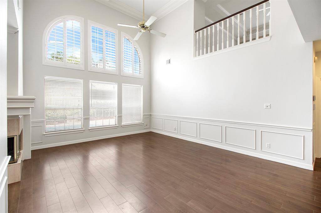 An abundance of natural light in the family room with double-height ceilings.
