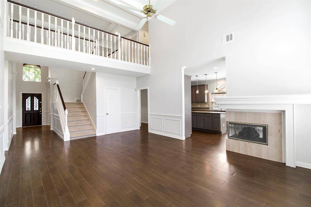 Cosy fireplace in the family room which leads to the kitchen.