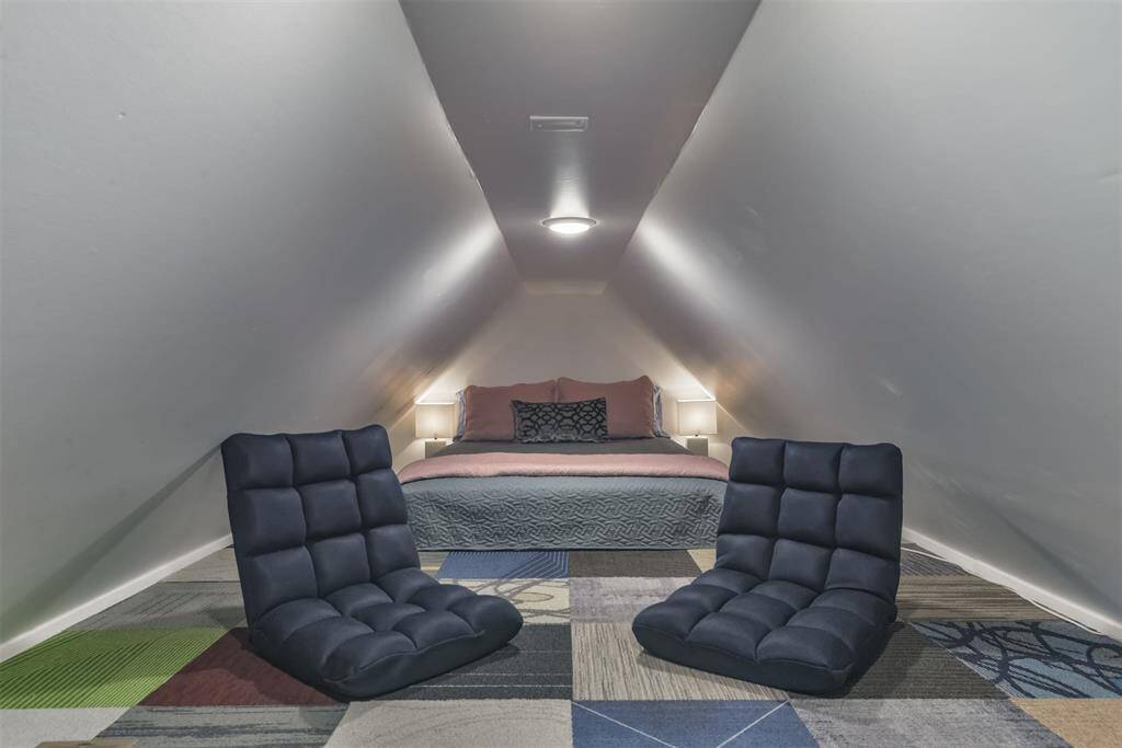 240 square foot sleeping loft with 4' ceiling and central HVAC ducting.  Only accessible by a ladder.