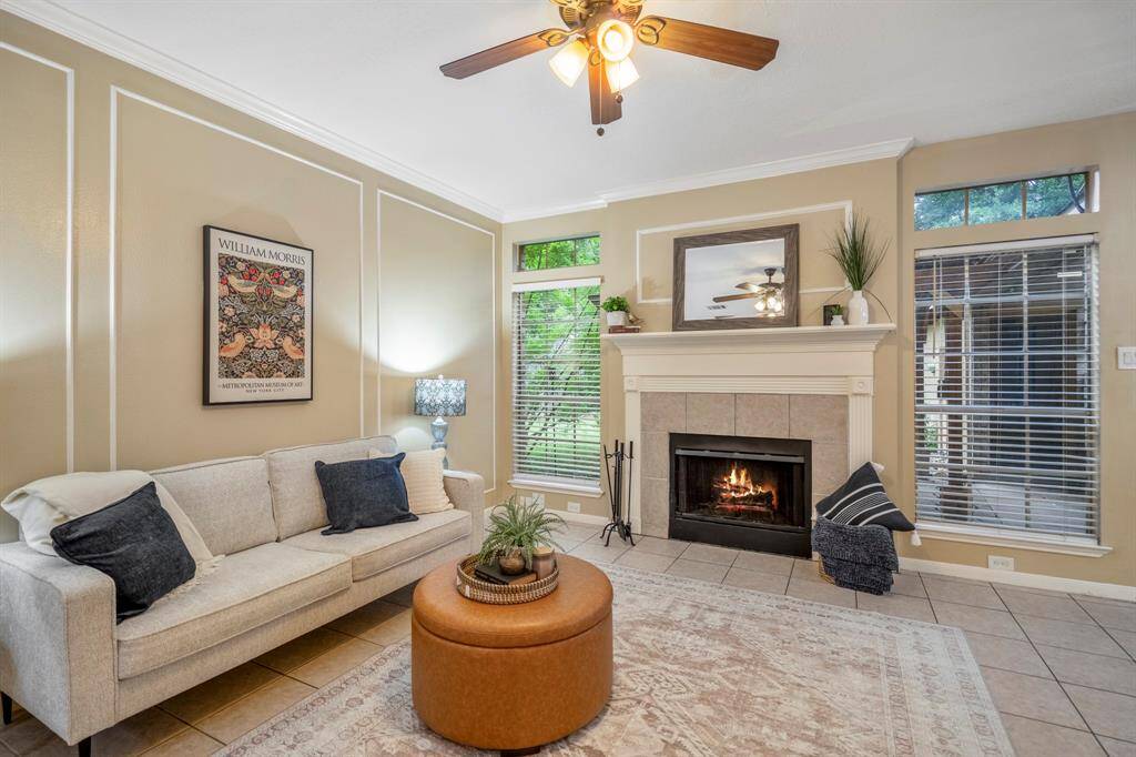 Um, hello there, you adorable living room! Warm tones, tile floors, and a cozy gas fireplace set the perfect vibe for unforgettable nights snuggled up on the couch with your favorite people.