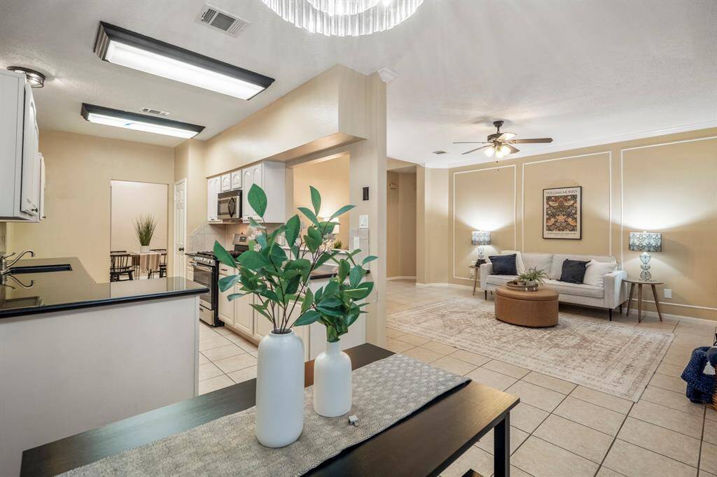 A view from the eat-in dining area into the inviting living room—where comfort meets connection and every seat feels like home.