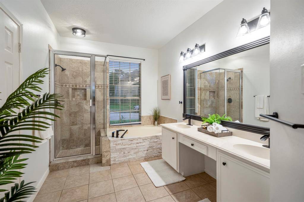 The primary ensuite features a luxurious soaking tub, separate shower, dual sinks, and not one—but TWO spacious closets. Because one just isn’t enough.