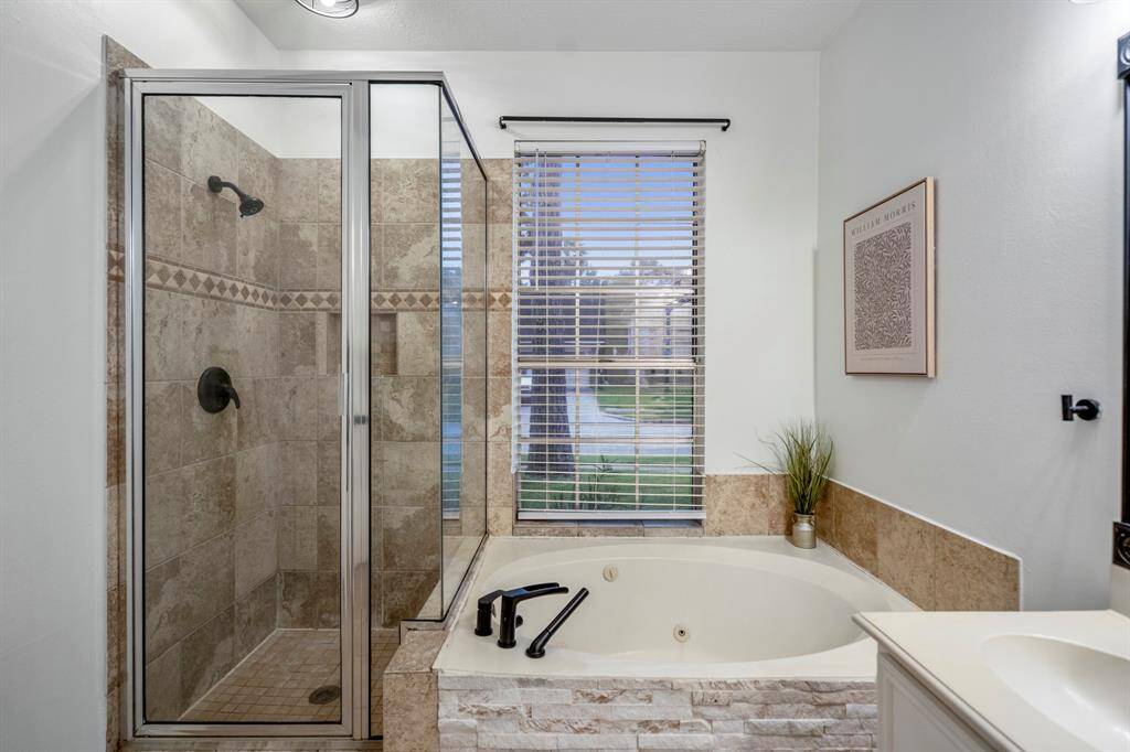 The primary ensuite features a luxurious soaking tub, separate shower, dual sinks, and not one—but TWO spacious closets. Because one just isn’t enough.
