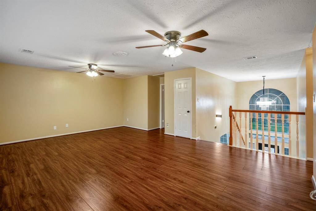 And now… check out the huge game room! There's plenty of space for a pool table, maybe a ping pong setup—or go all out and create your own home theater. It’s your space to play, relax, and entertain!