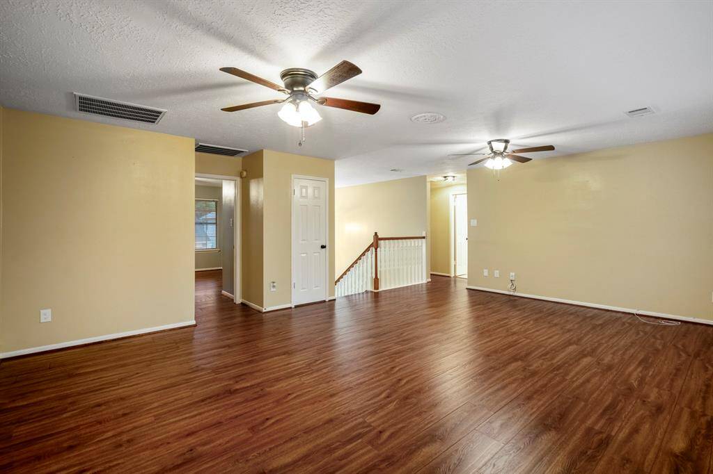 And now… check out the huge game room! There's plenty of space for a pool table, maybe a ping pong setup—or go all out and create your own home theater. It’s your space to play, relax, and entertain!