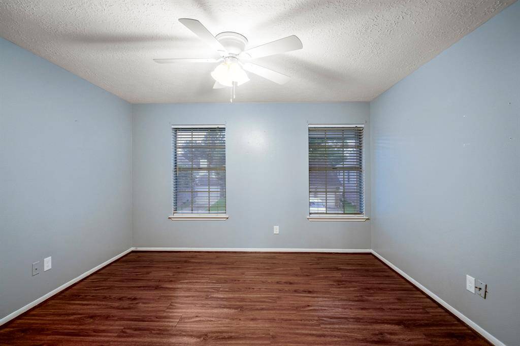 Here’s a look at bedroom number 2—located upstairs, featuring a spacious walk-in closet and zero carpet for easy upkeep and a sleek, clean feel.